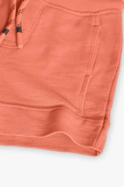 Bermuda a maglia per bambino in colore arancione