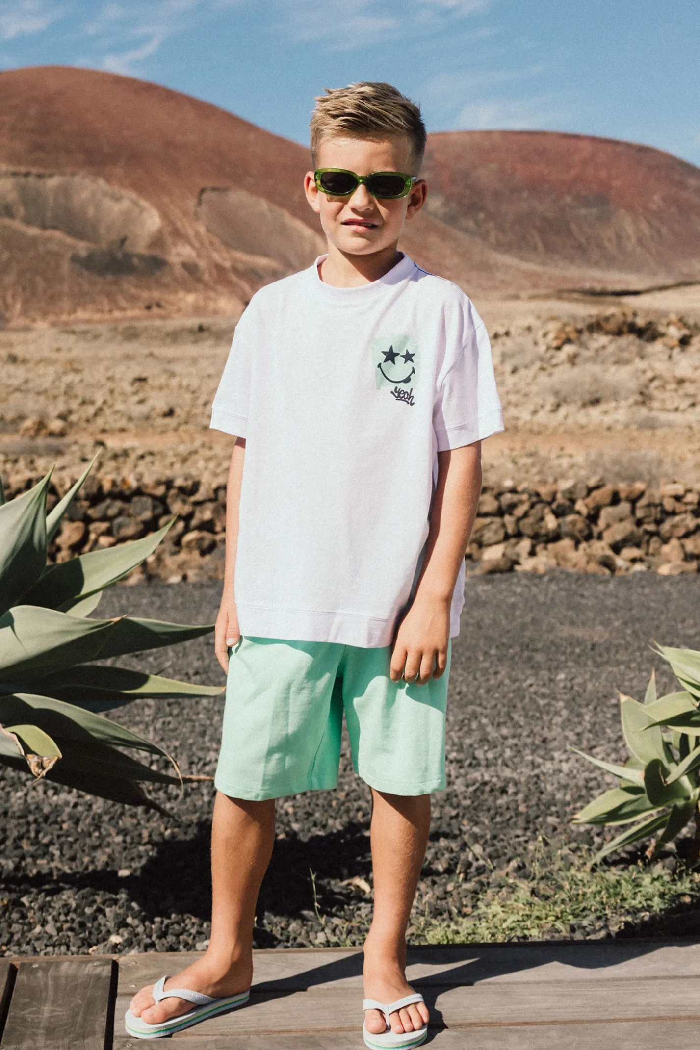 Bermuda in maglia per bambino di colore verde