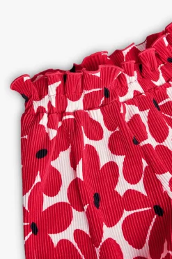 Bermuda in maglia per bambina con stampa di fiori rossi