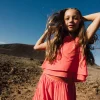 Blusa di chiffon per bambina di colore rosso.