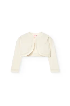 Bolero in maglia per neonata in bianco.