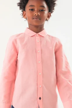 Camicia di lino per bambino a maniche lunghe di colore rosa.