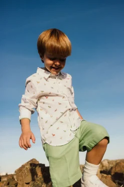 Camicia in popeline per bambini stampata in colore bianco con motivo di dinosauri