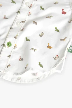 Camicia in popeline per bambini stampata in colore bianco con motivo di dinosauri