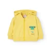 Cardigan per neonato di colore giallo.