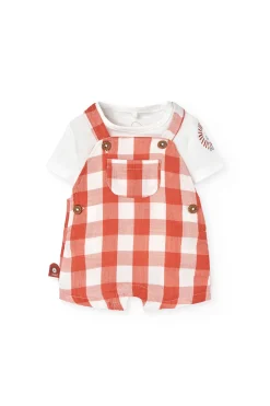 Completo coordinato in maglia per neonato in arancione e bianco con motivo a quadri.