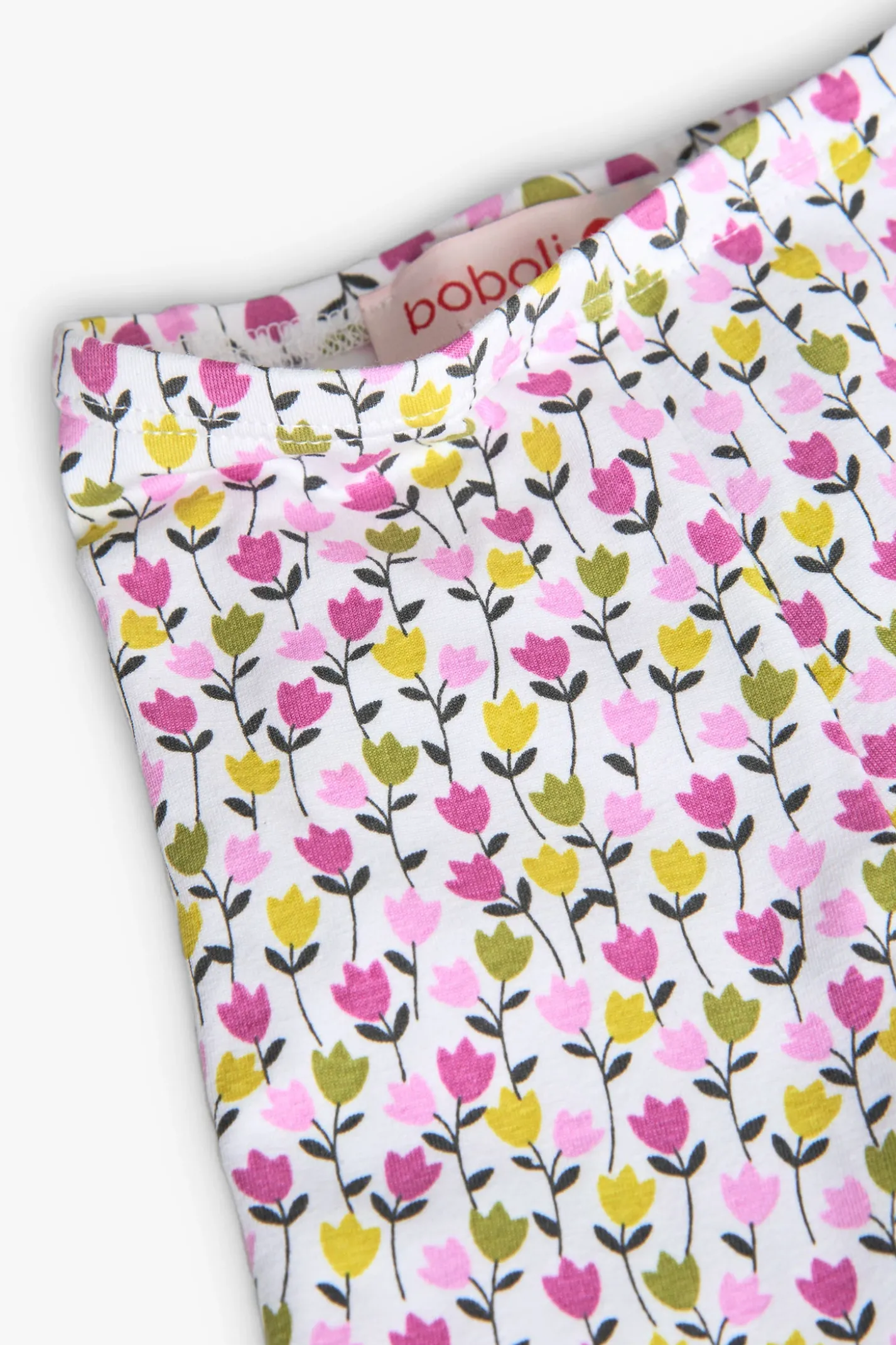 Completo di maglietta e pantalone a maglia per neonata in colore verde con stampa floreale.