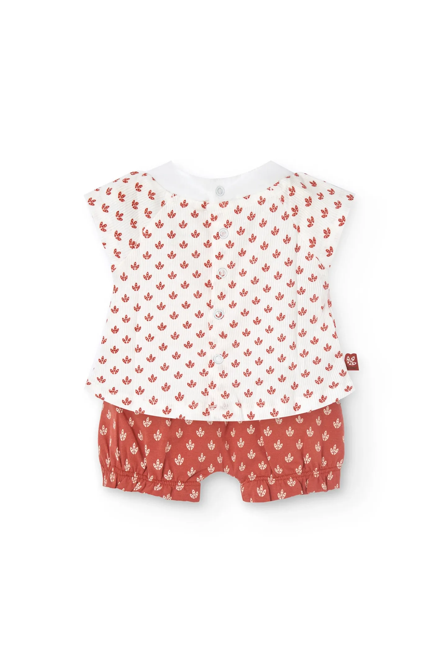 Completo in maglia per neonata con stampa floreale in rosso.