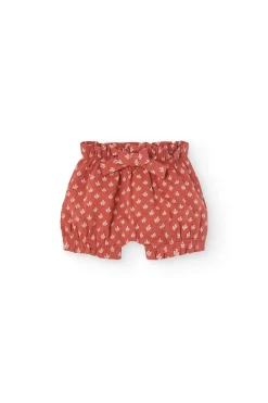Completo in maglia per neonata con stampa floreale in rosso.