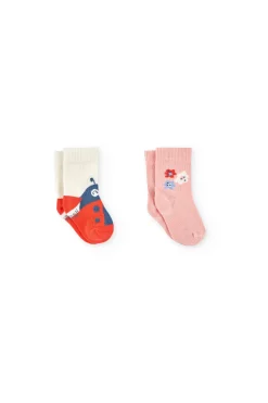 Confezione di calzini a maglia per neonata in colore rosa.