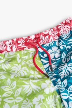 Costume da bagno in tessuto riciclato per bambino di colore verde con motivo floreale.