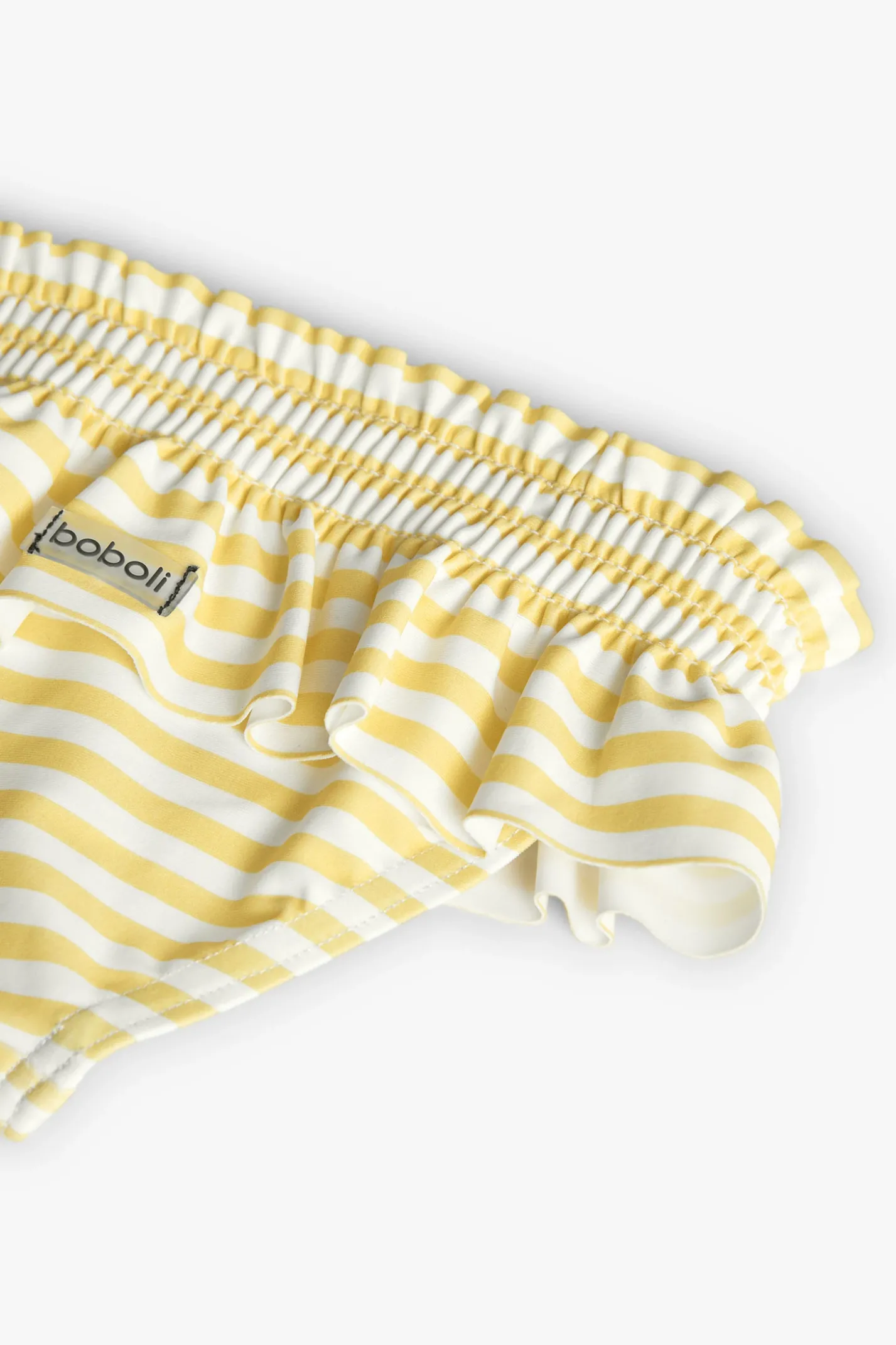 Costume slip in poliammide per neonata a righe gialle e bianche.