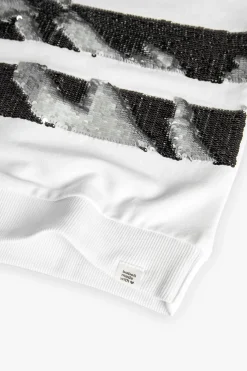 Felpa per bambina di colore bianco.