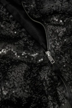 Giacca con paillettes per bambina di colore nero.