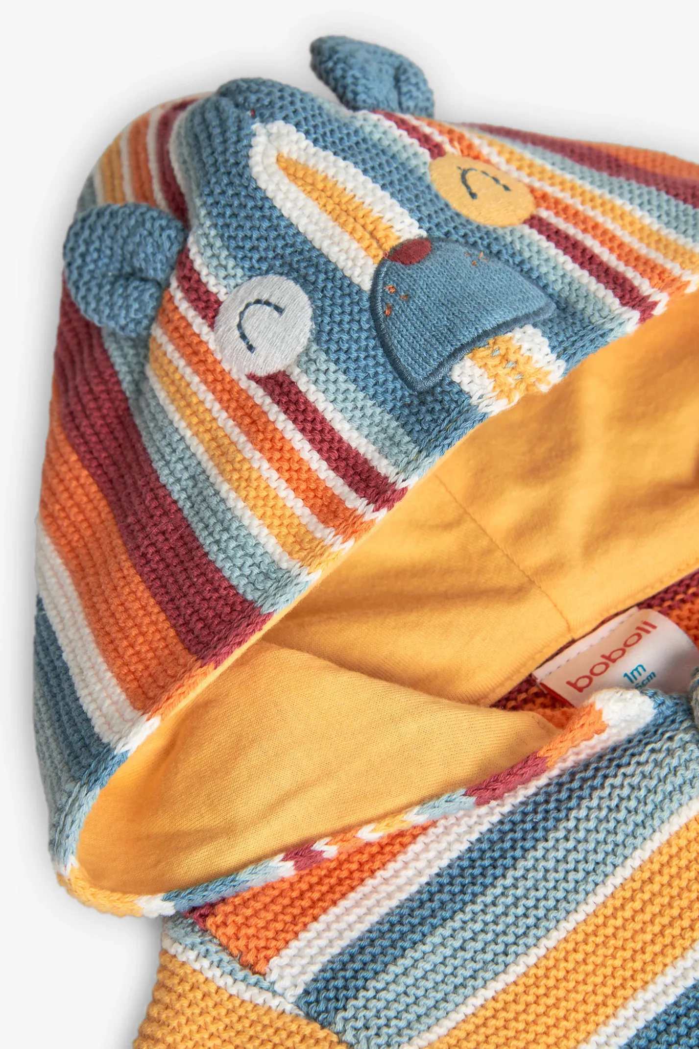Giacca di maglia per neonati di colore giallo con design a righe.