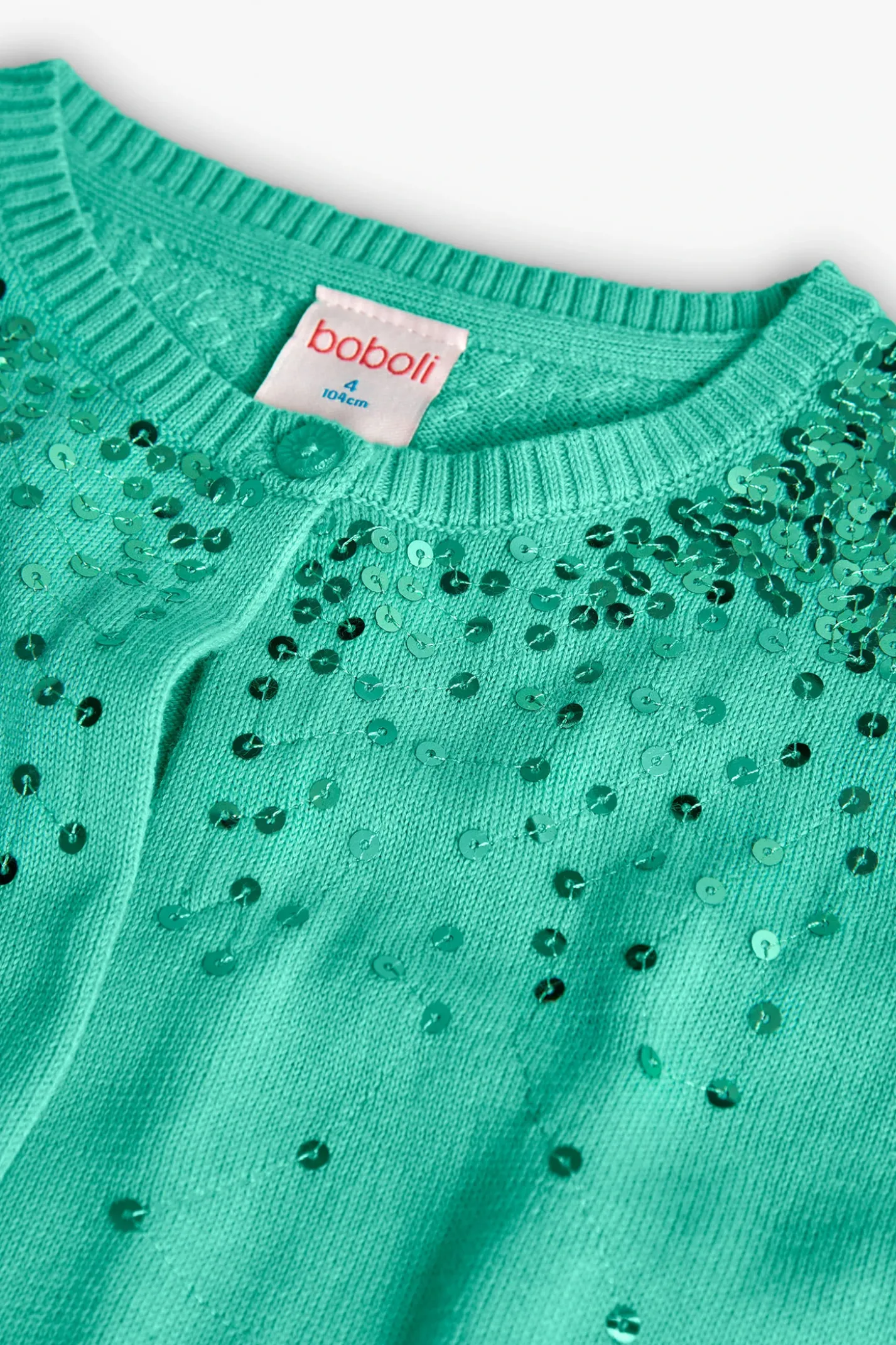 Giacca in maglia per bambina di colore verde con design brillante.