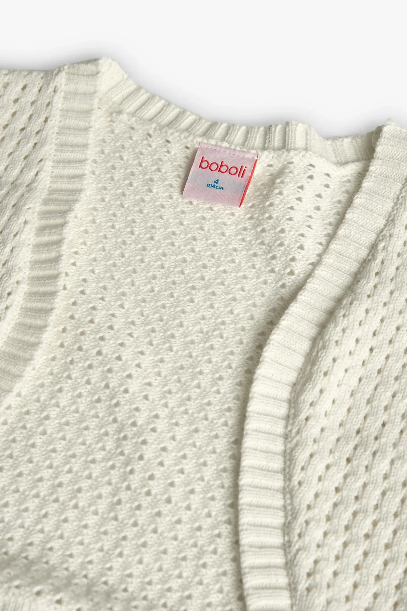Giacca tricotosa per bambina di colore bianco.