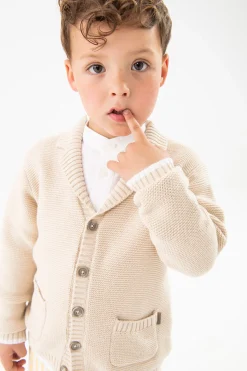 Giacchetta in maglia per neonato di colore beige.