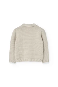 Giacchetta in maglia per neonato di colore beige.