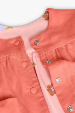 Giacchetta reversibile in maglia per bambina nei colori rosso e rosa