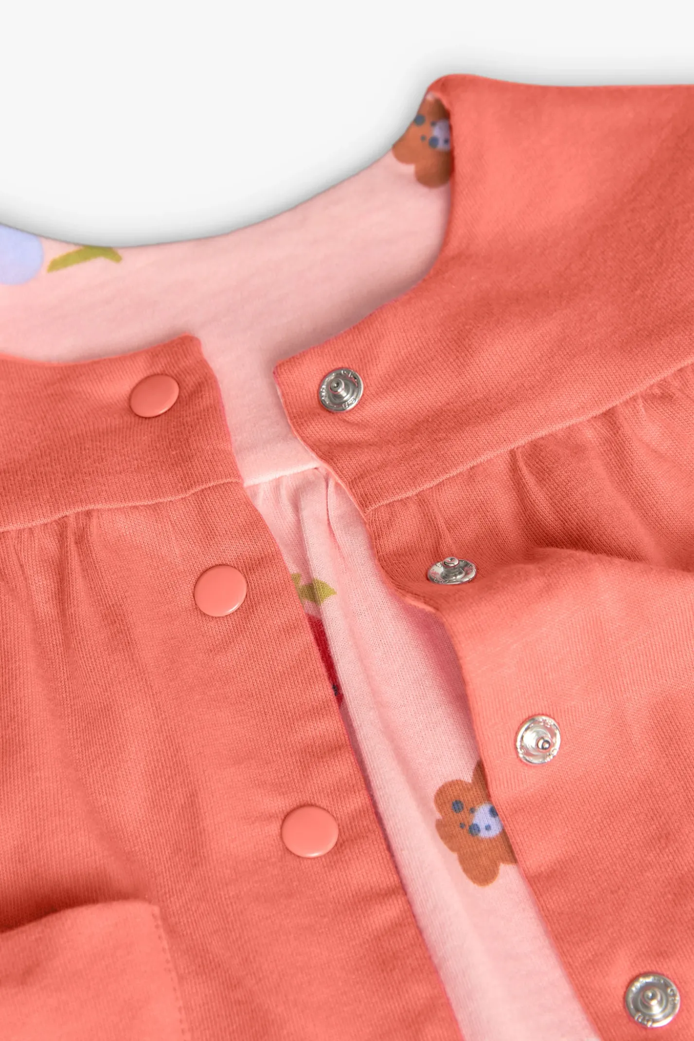 Giacchetta reversibile in maglia per bambina nei colori rosso e rosa