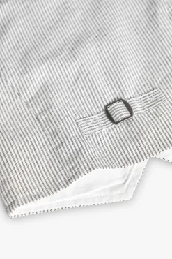 Gilet oxford per bambino a righe grigie e bianche.