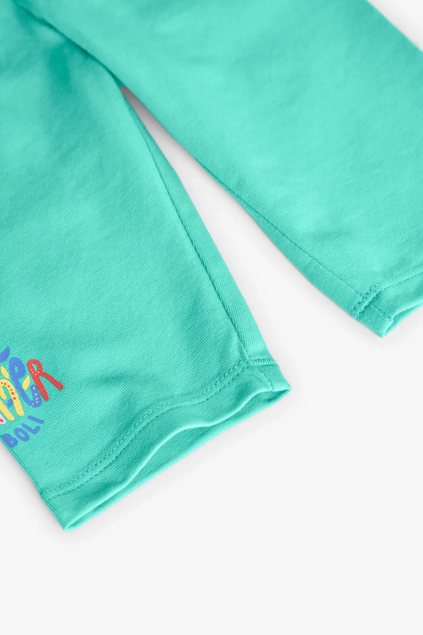 Leggings a maglia per bambina in colore verde.