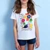 Maglietta a maglia per bambina in bianco con stampa floreale.