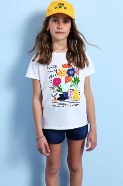 Maglietta a maglia per bambina in bianco con stampa floreale.