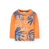 Maglietta a maglia per bambino in arancione a maniche lunghe.