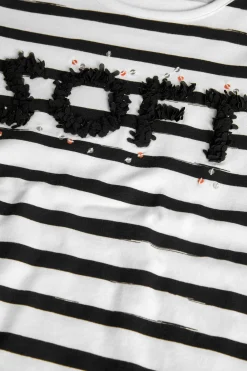 Maglietta a maglia per bambina con design a righe nei colori bianco e nero