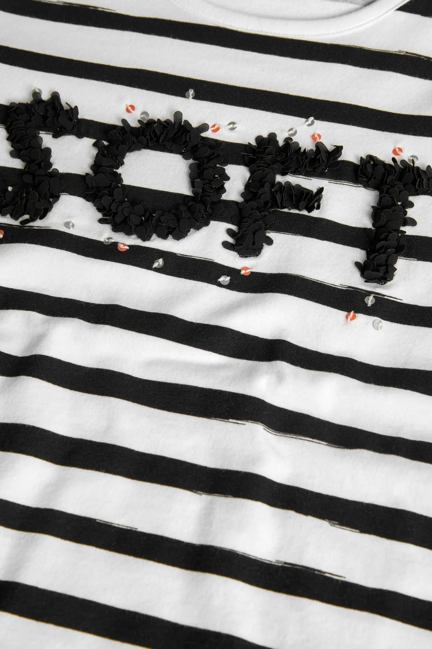 Maglietta a maglia per bambina con design a righe nei colori bianco e nero