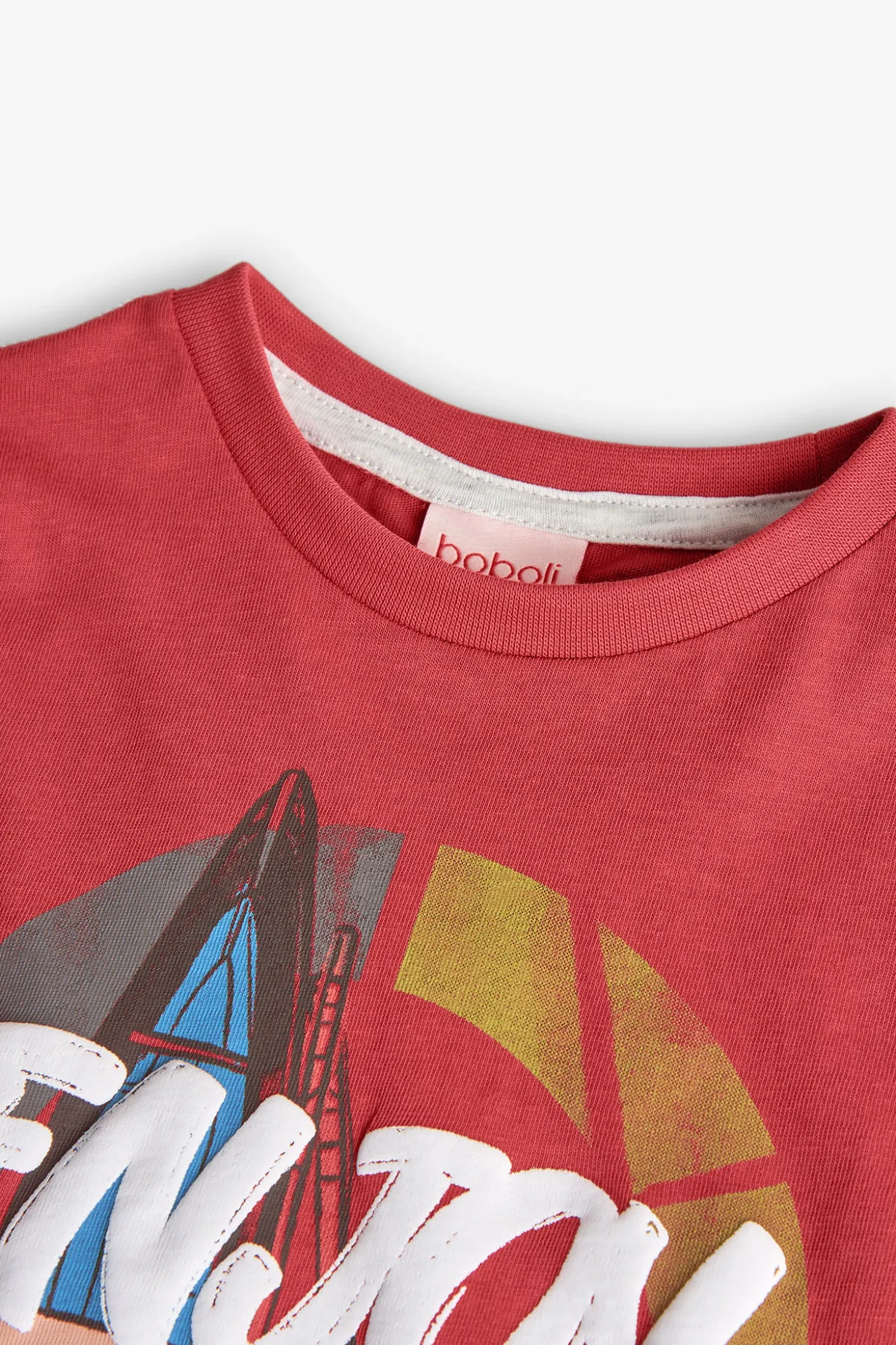 Maglietta a maglia per bambino in colore granata.