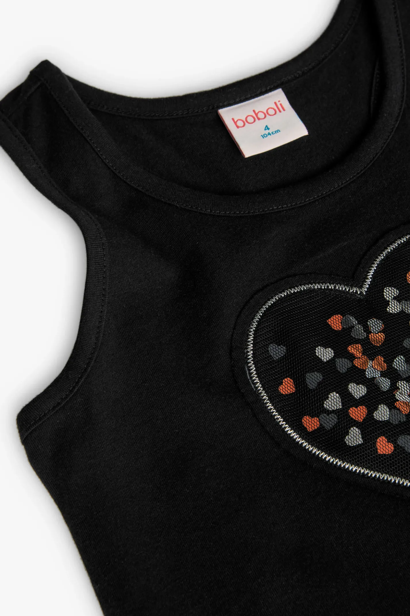 Maglietta a maglia per bambina di colore nero con motivo a cuore.