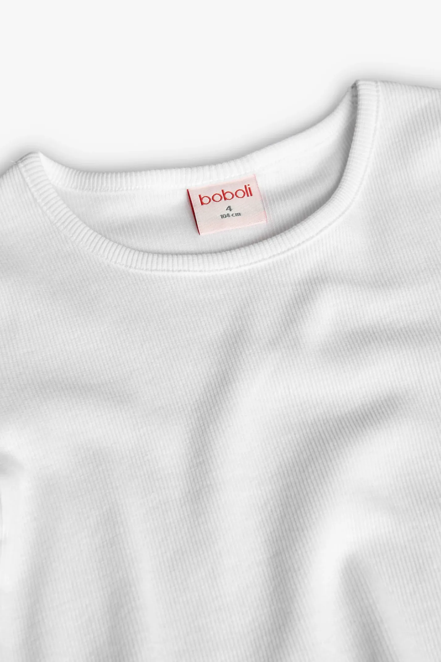 Maglietta di base in maglia per bambina di colore bianco.