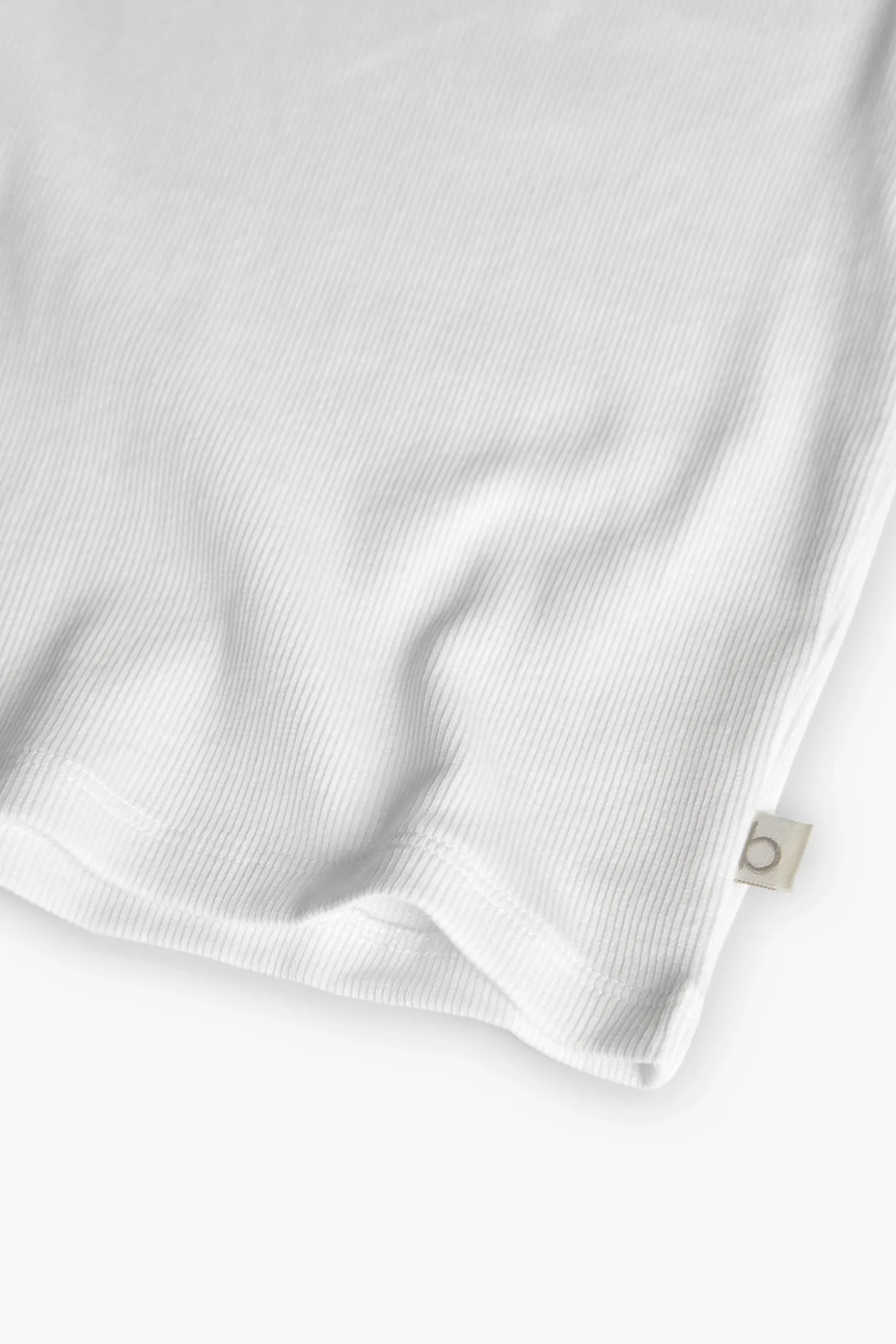 Maglietta di base in maglia per bambina di colore bianco.