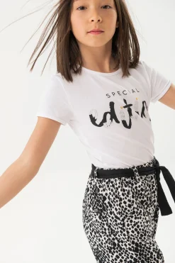 Maglietta di maglia elastica per bambina di colore bianco