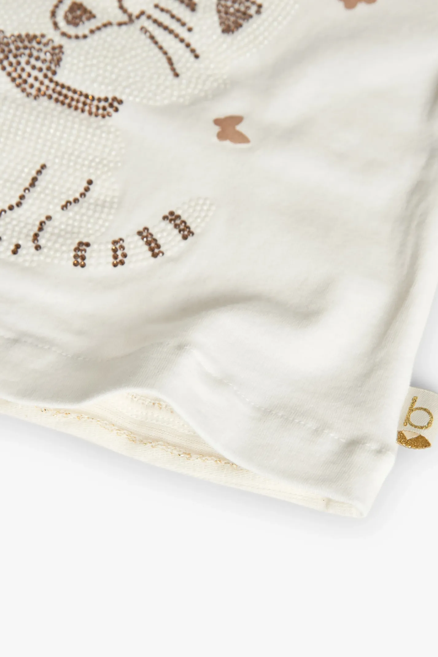 Maglietta di maglia per neonata in colore bianco.