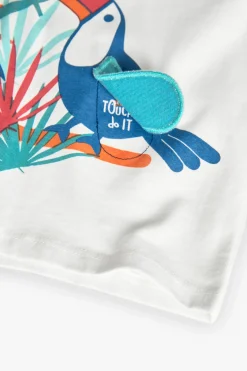 Maglietta in jersey per bebè maschio di colore bianco con stampa tropicale.