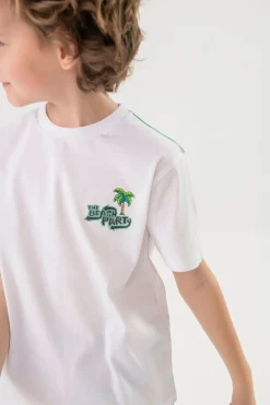 Maglietta in maglia per bambino bianca con design di leone surfista