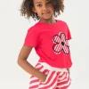 Maglietta in maglia per bambina di colore fragola con motivo floreale.