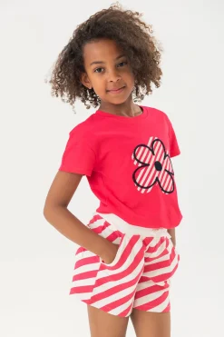 Maglietta in maglia per bambina di colore fragola con motivo floreale.