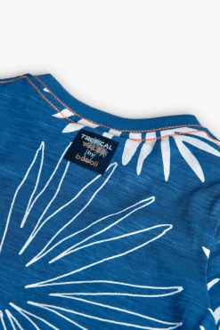 Maglietta in maglia per bambino di colore blu con design tropicale.