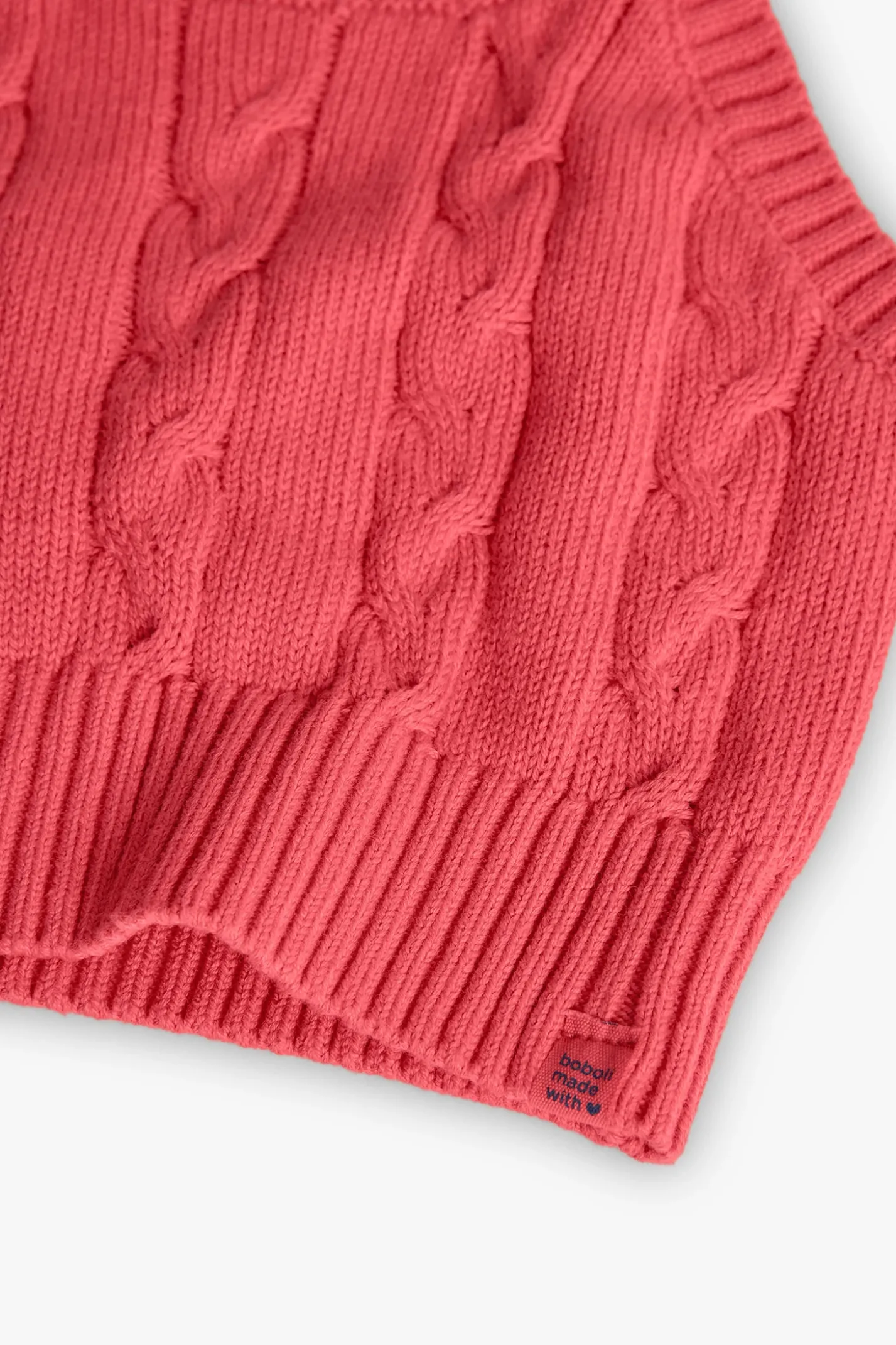 Maglione in maglia per bambina in colore fragola.