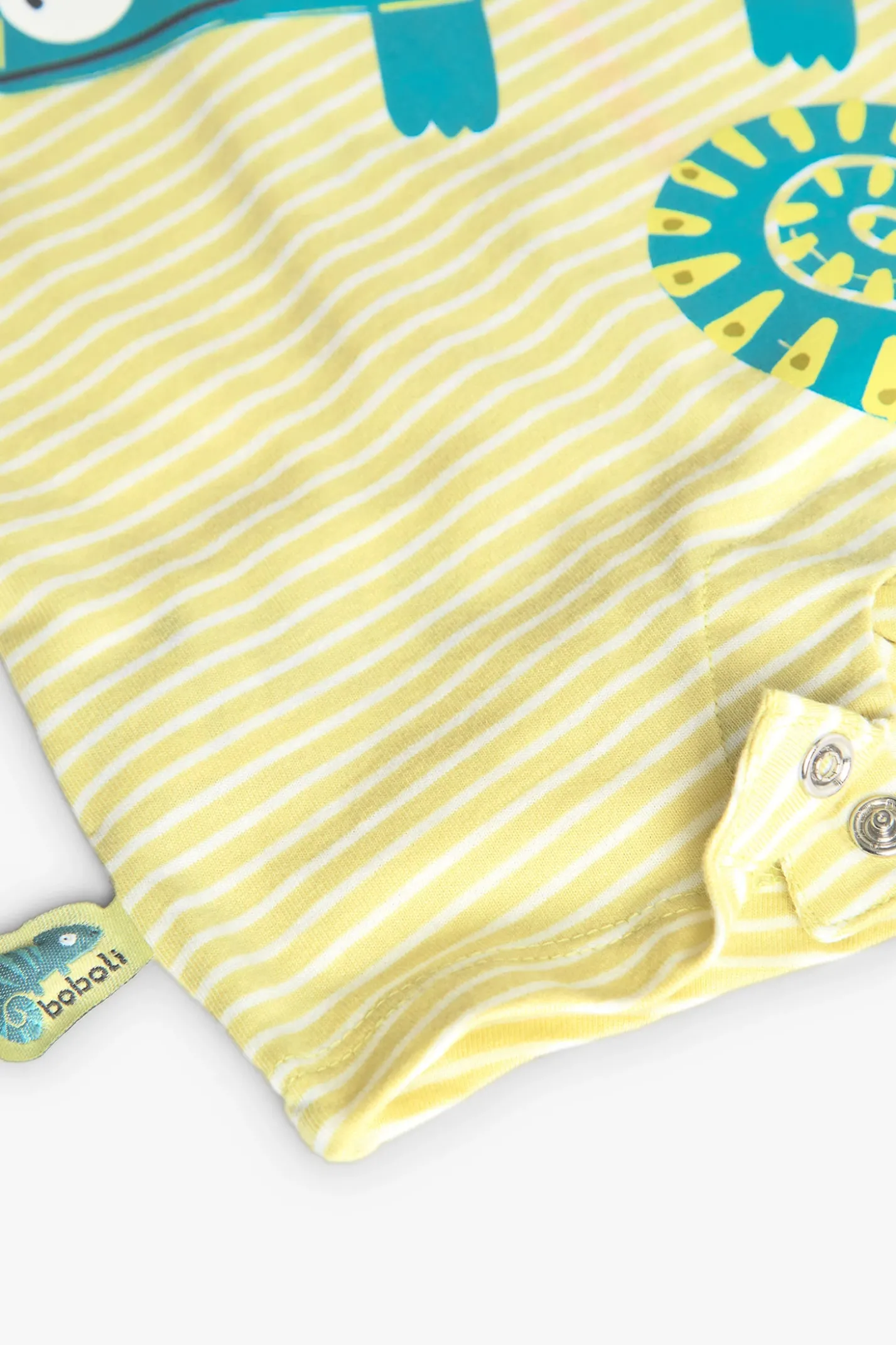 Pagliaccetto a maglia per neonato colore giallo con stampa di camaleonte.