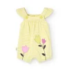 Pagliaccetto in maglia per bambina in colore giallo a righe con motivo floreale.