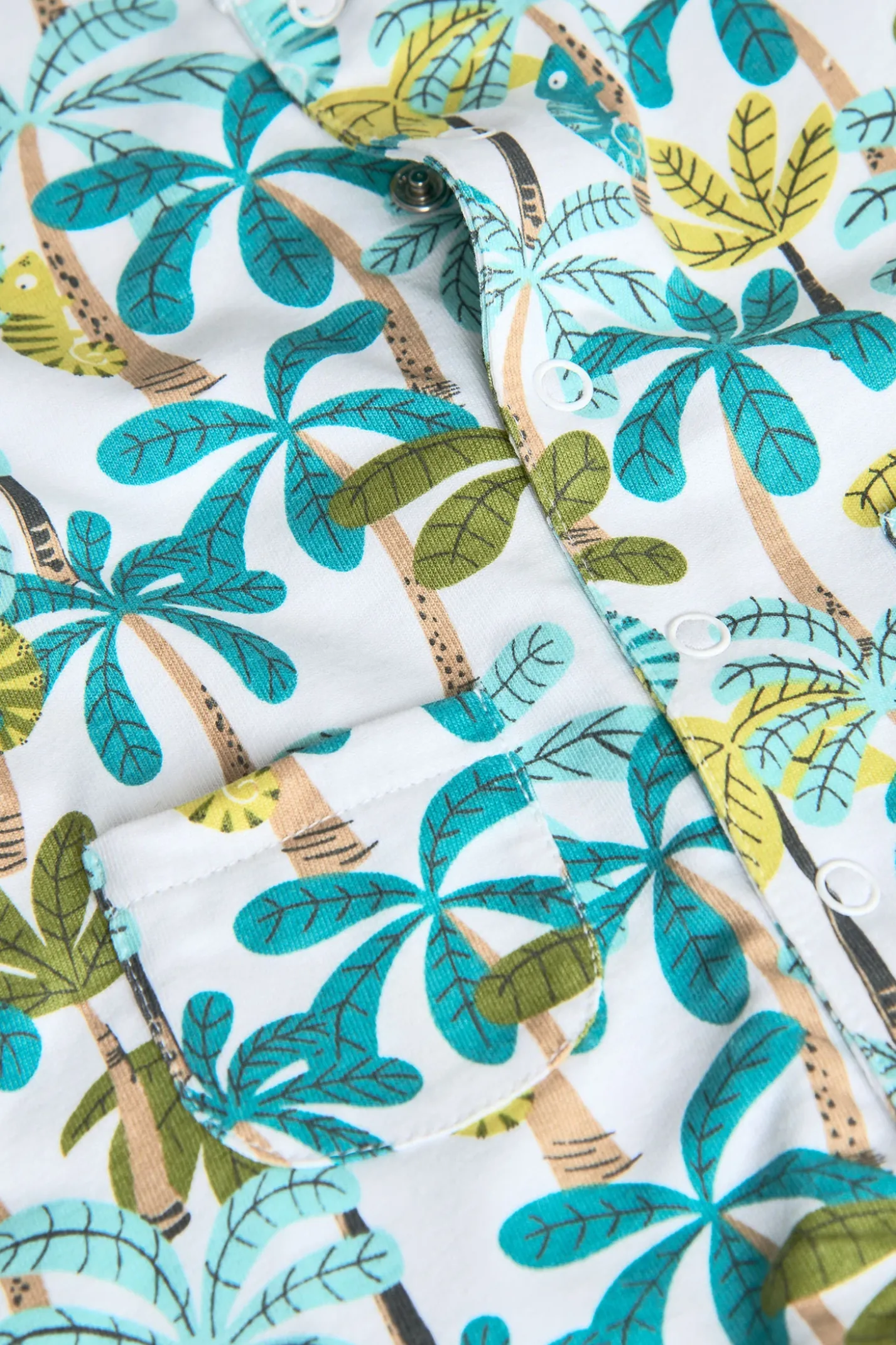 Pagliaccetto in maglia per neonato in colore blu e verde con stampa di palme.