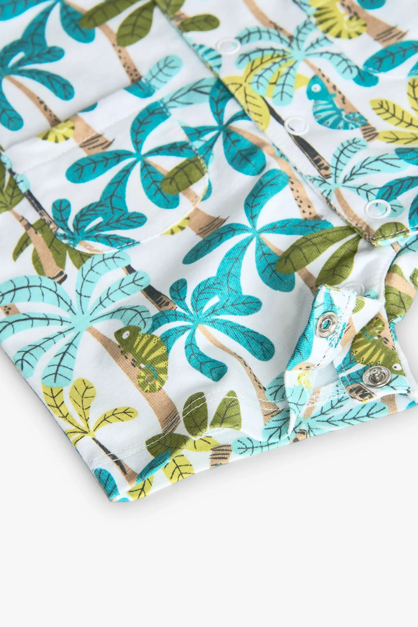 Pagliaccetto in maglia per neonato in colore blu e verde con stampa di palme.