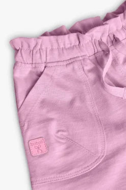 Pantaloncini in maglia per neonata di colore rosa