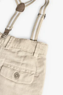 Pantaloni in lino per bambino in beige con bretelle.